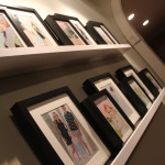 a closer look at the ledge shelving and photo wall
